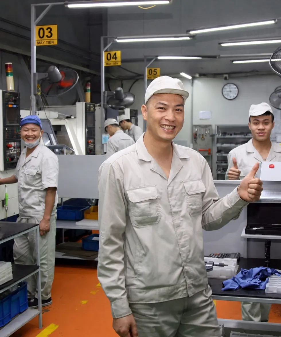 Vietnamese manufacturing workers in a production facility